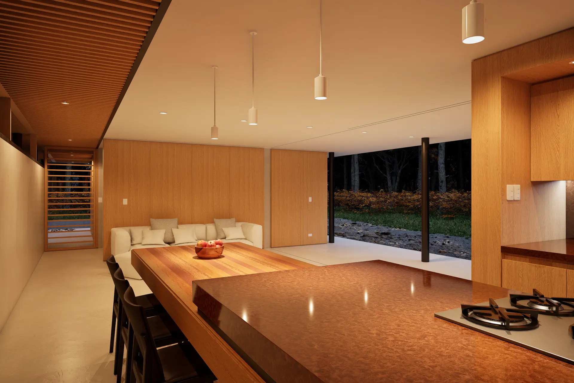 Seamless open-plan kitchen and living space featuring warm timber framing and limestone surfaces