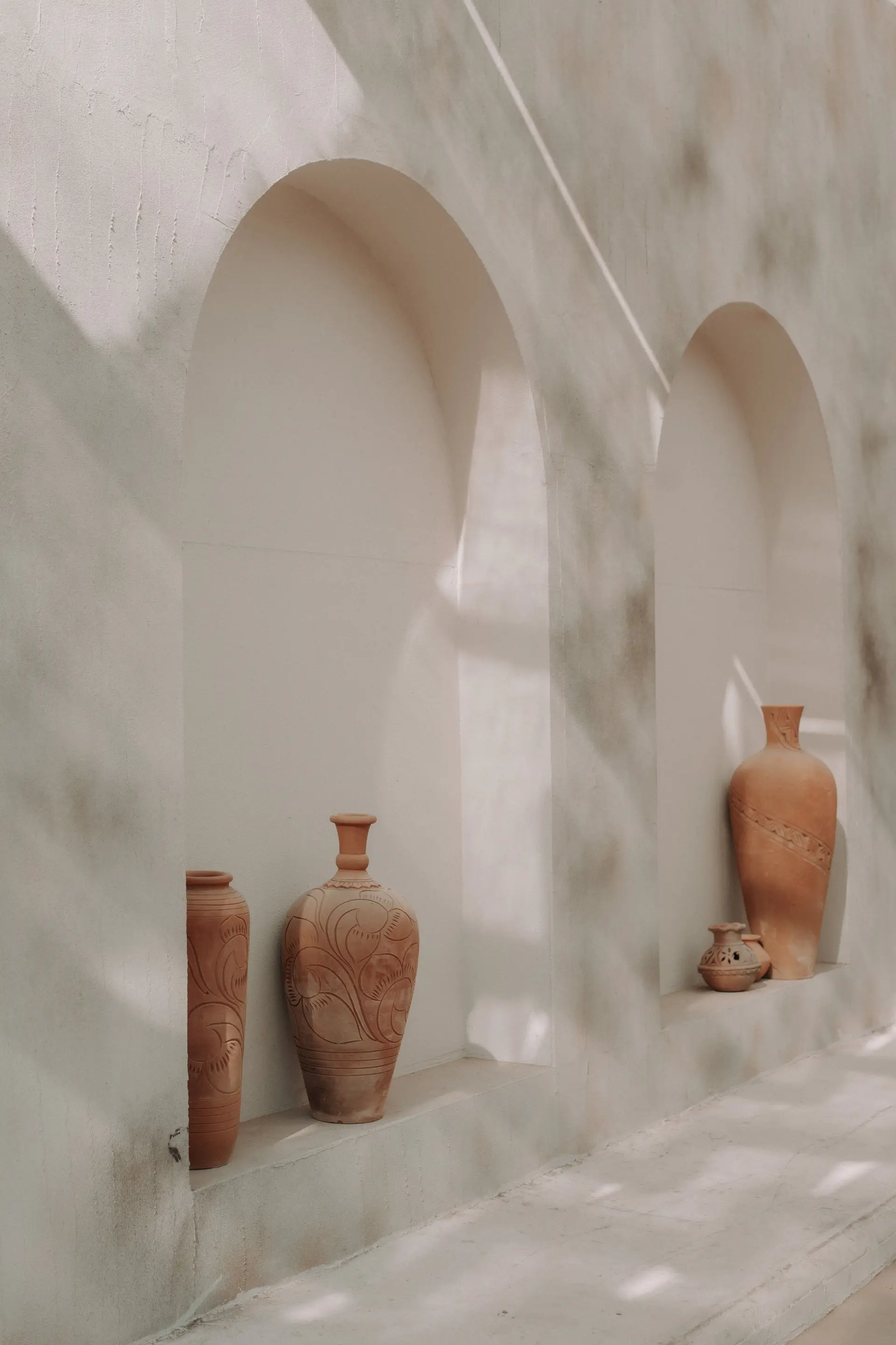 Sculptural terracotta forms in an architectural lightwell