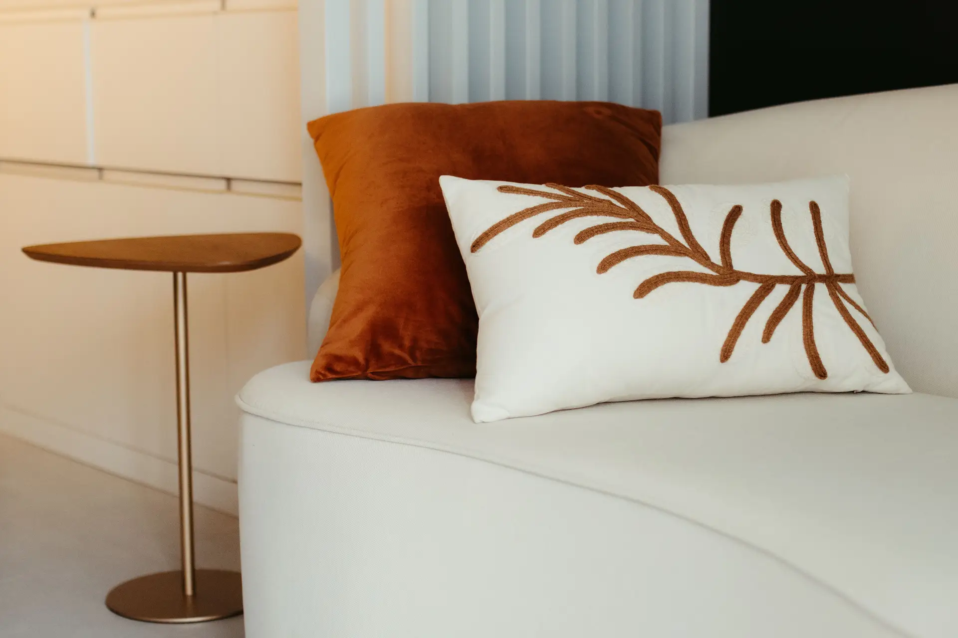 Subtle textile styling with neutral ceramic vessels