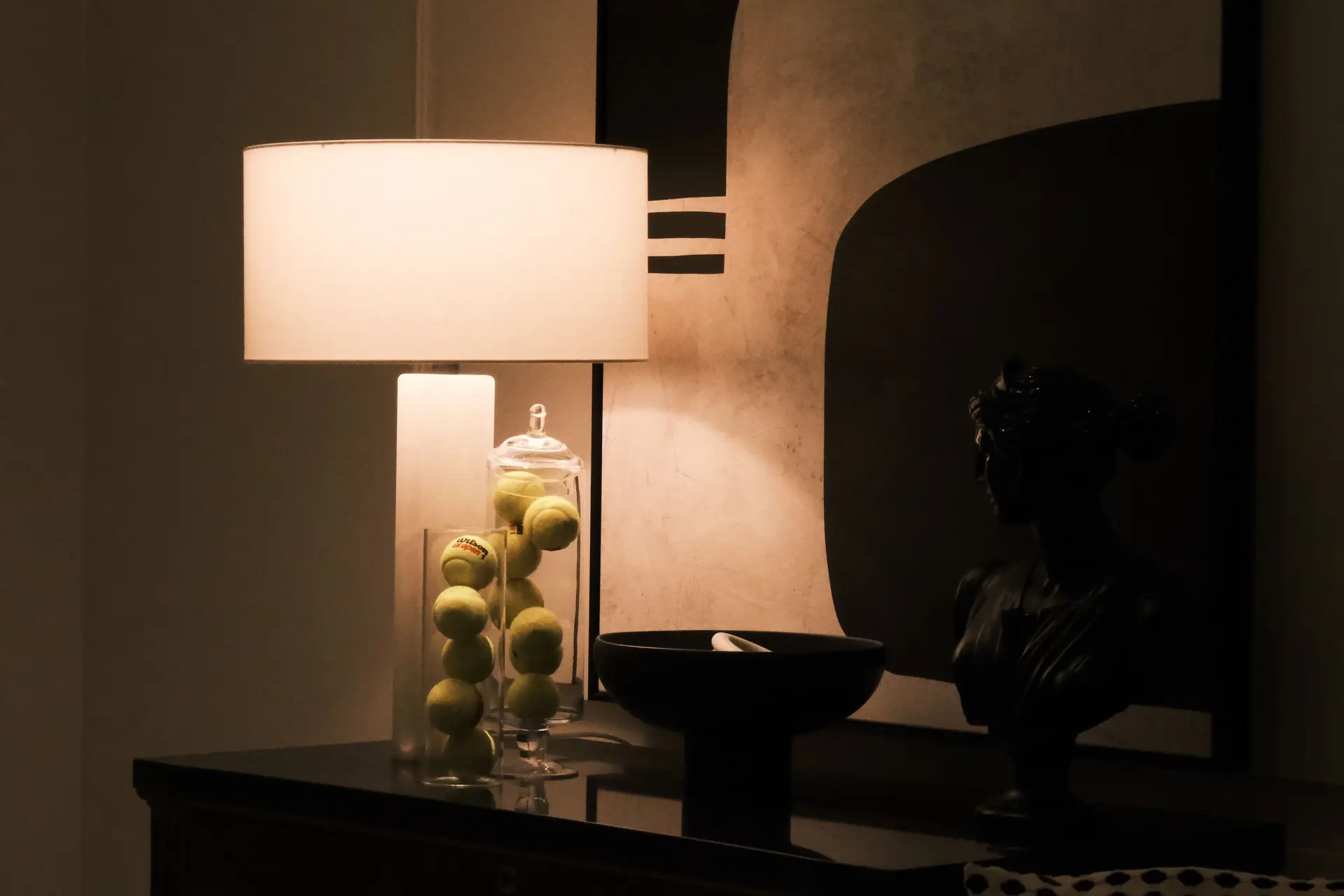 Artisan stone bust and sculptural lamp styling