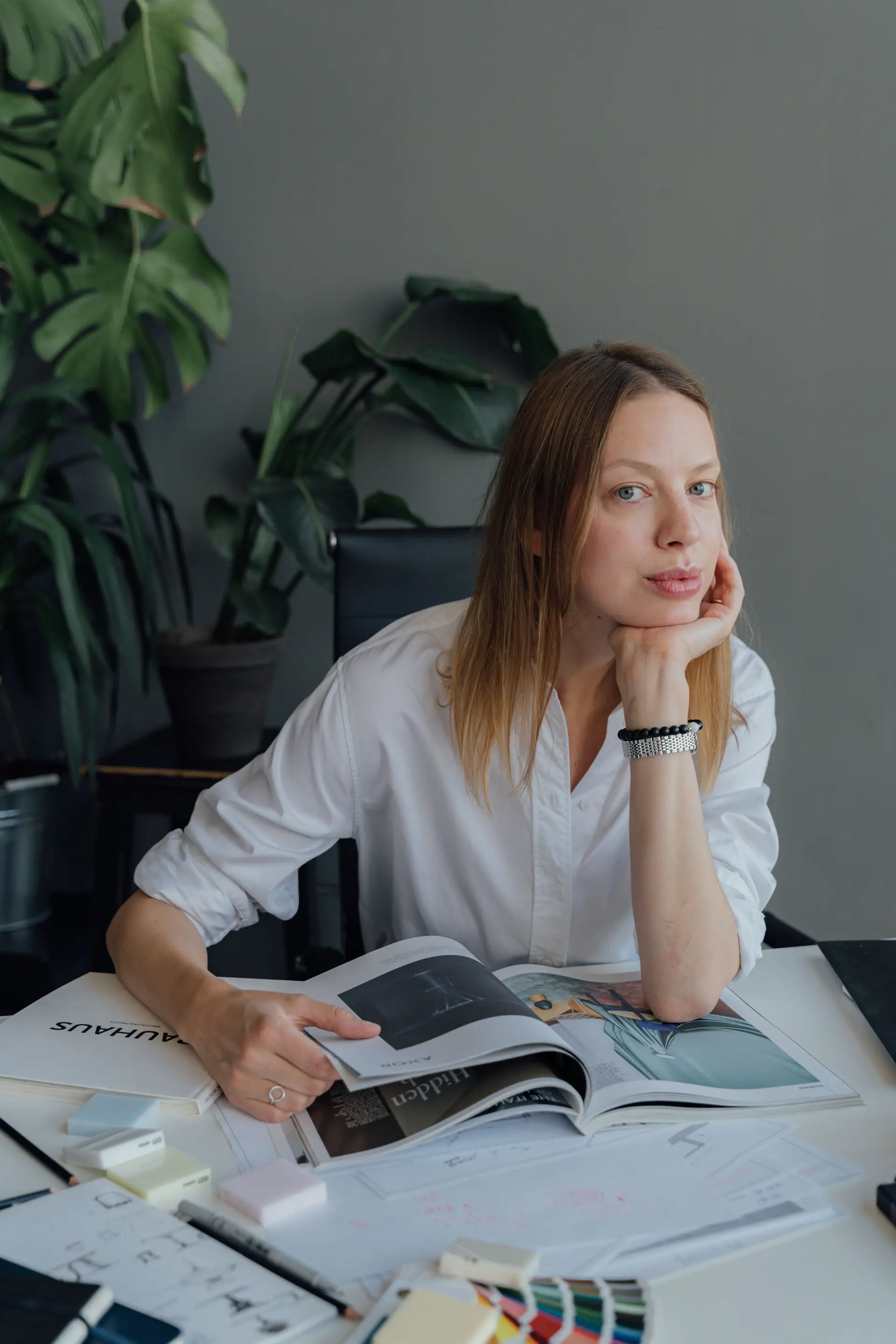 Lead interior designer curating textile swatches and design finishes inside the Toronto studio